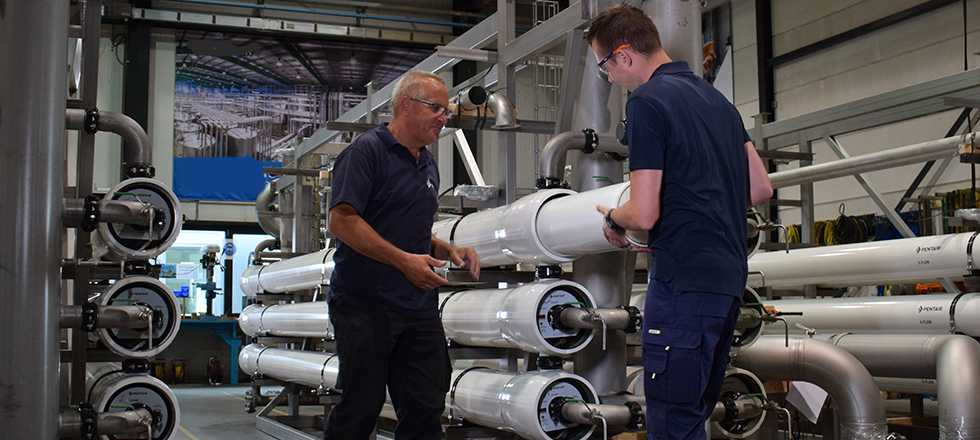 Technicians working with membranes